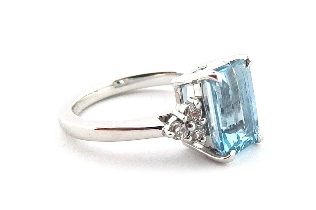1.87ct Emerald cut Aquamarine set in a handmade 18ct white gold ring with six brilliant cut claw set diamonds
