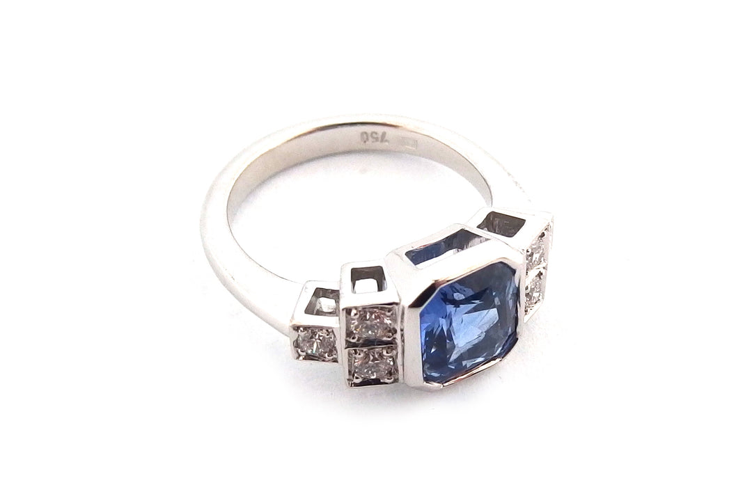 18ct white gold bezel set emerald cut sapphire ring
