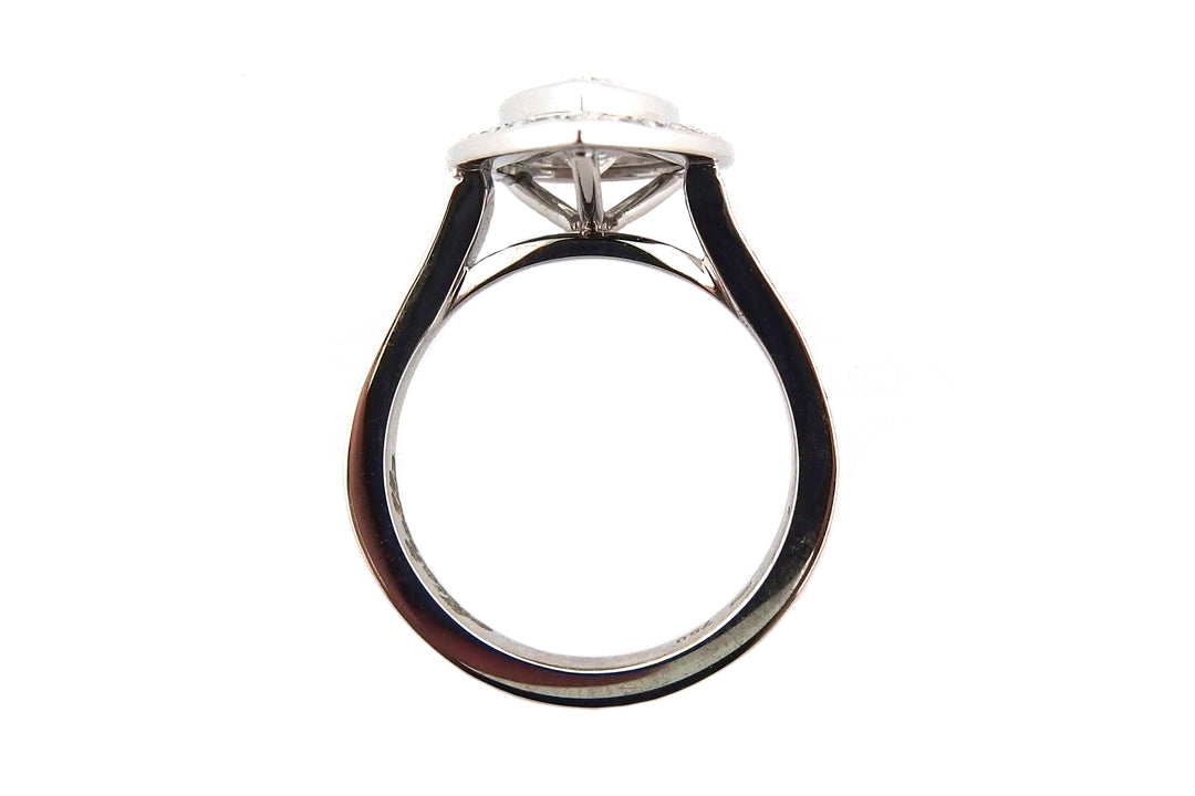 18ct white gold bezel set pear shape diamond halo ring with diamonds on the band