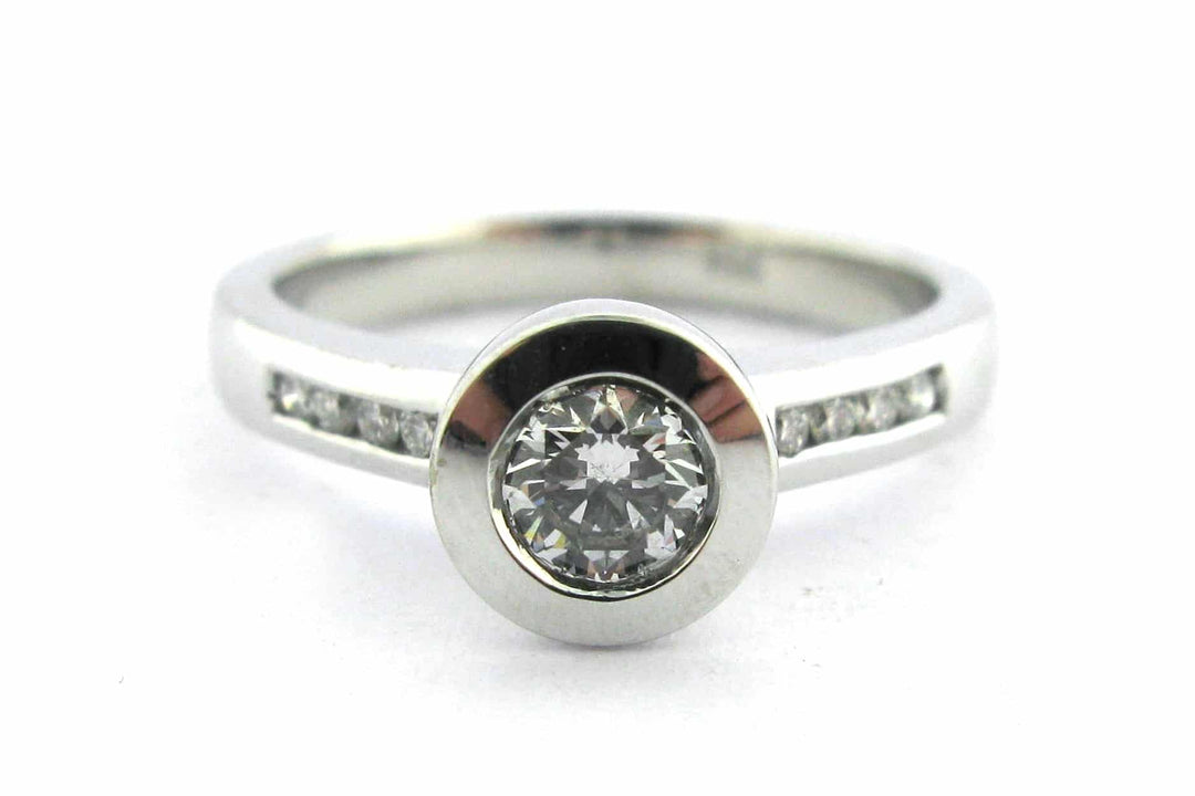 Bezel set round brilliant cut diamond ring