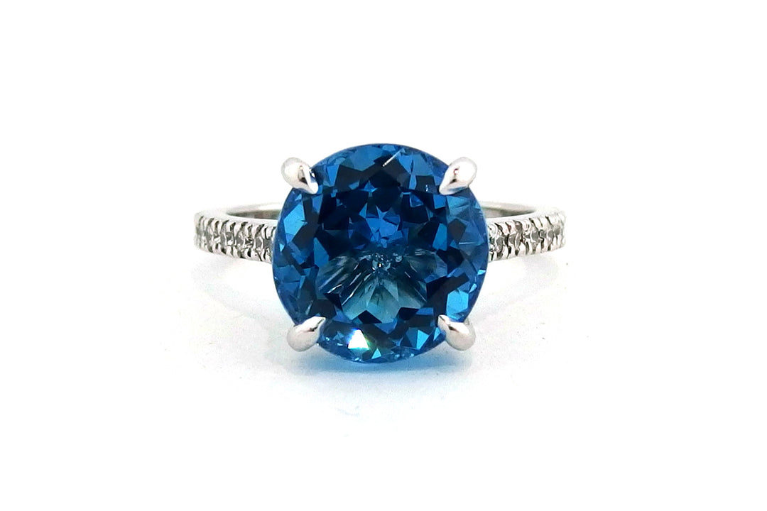 18ct white gold blue topaz ring with diamonds on the band