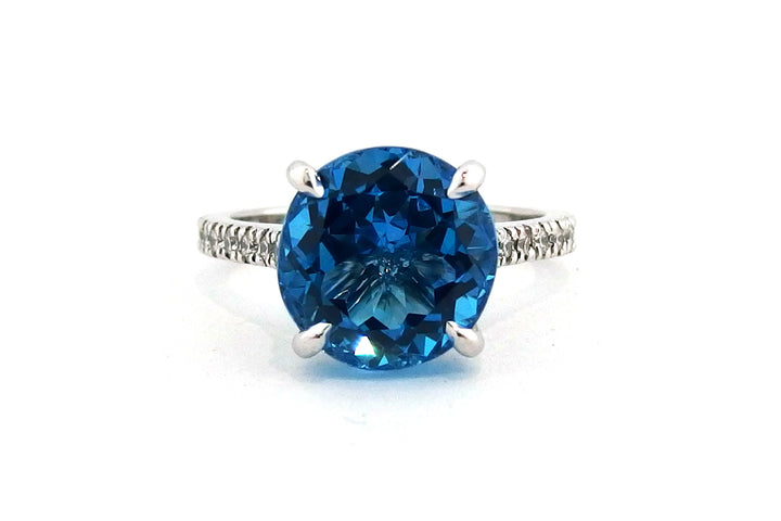 18ct white gold blue topaz ring with diamonds on the band