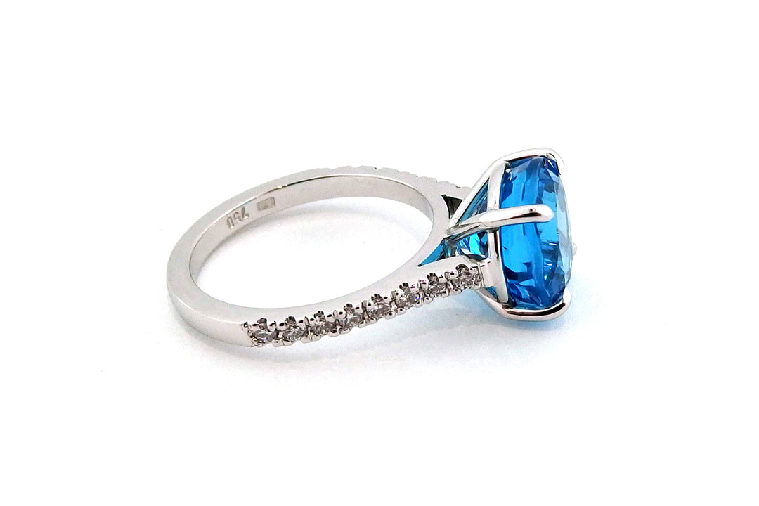 18ct white gold blue topaz ring with diamonds on the band
