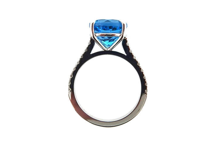 18ct white gold blue topaz ring with diamonds on the band