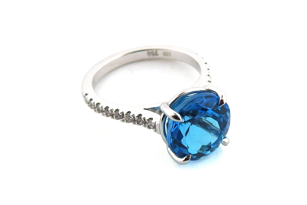 18ct white gold blue topaz ring with diamonds on the band