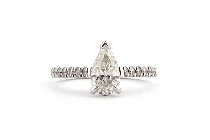 18ct white gold claw set pear shape ring with diamonds on the band