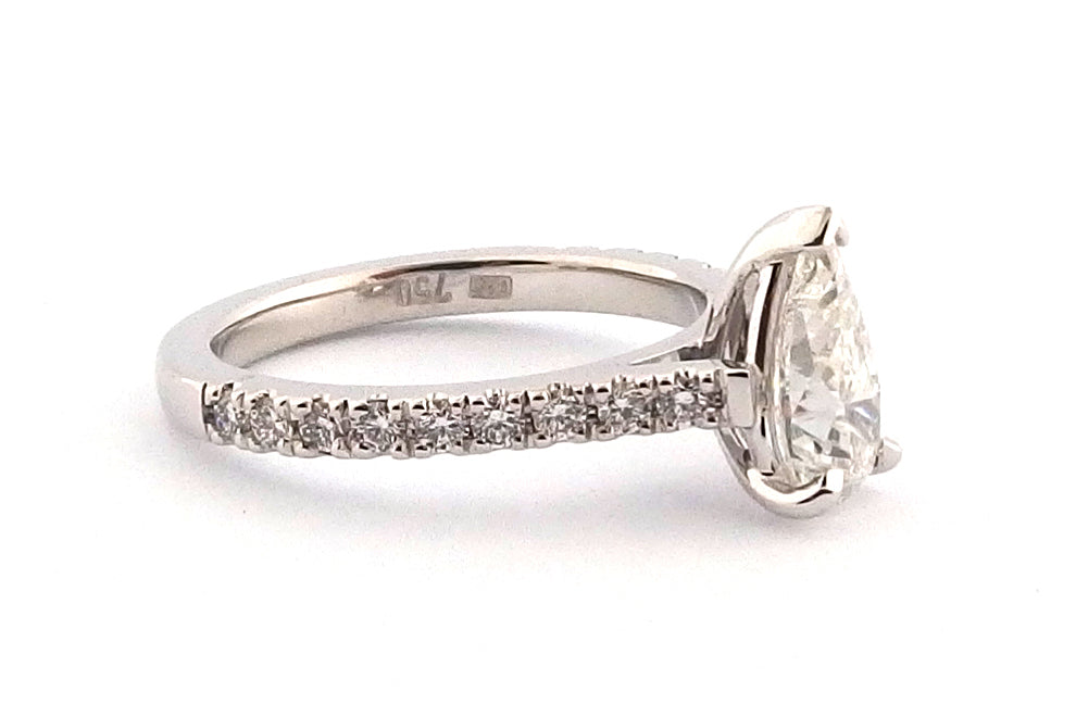 18ct white gold claw set pear shape ring with diamonds on the band