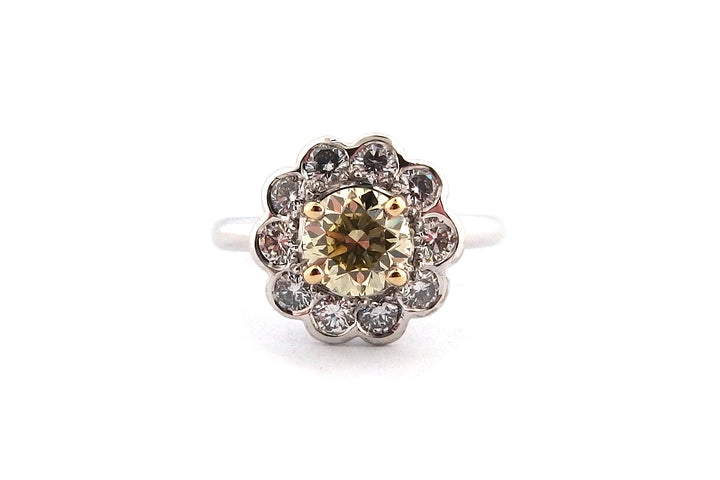 18ct white gold halo ring set with a round brilliant cut yellow diamond