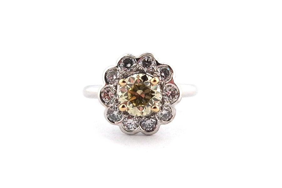 18ct white gold halo ring set with a round brilliant cut yellow diamond