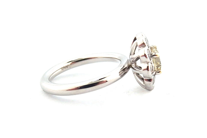 18ct white gold halo ring set with a round brilliant cut yellow diamond