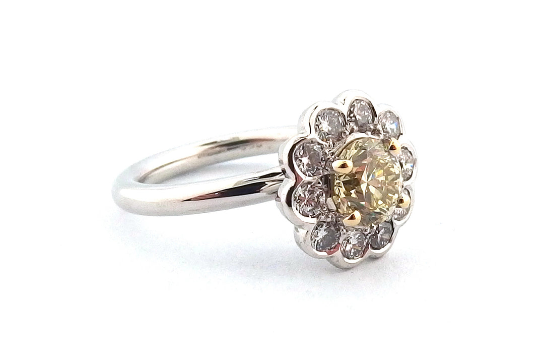 18ct white gold halo ring set with a round brilliant cut yellow diamond