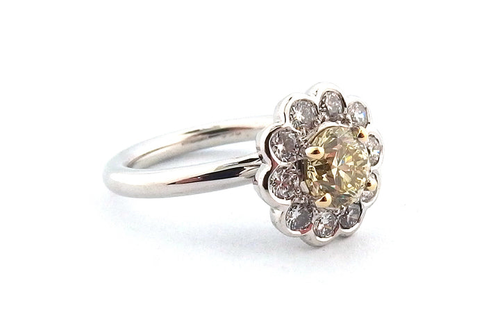 18ct white gold halo ring set with a round brilliant cut yellow diamond