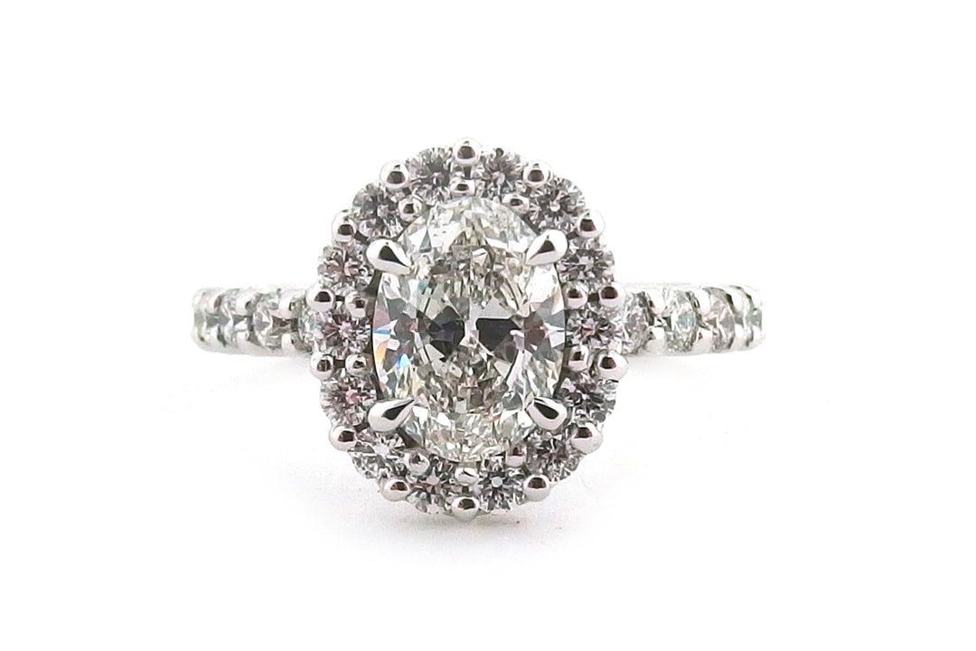 18ct white gold oval diamond with a cluster of round diamonds- front image