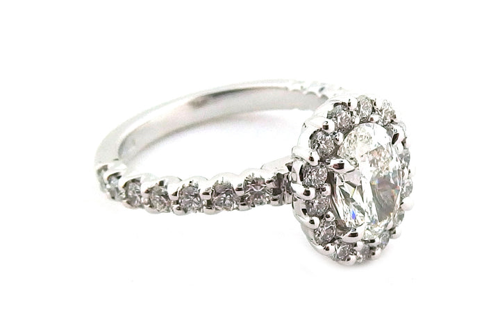 18ct white gold oval diamond with a cluster of round diamonds- front image