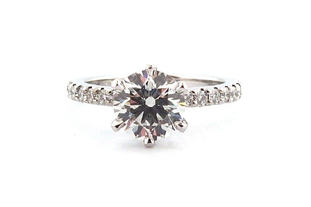 18ct white gold six claw set natural round brilliant cut diamond ring with diamonds on the band