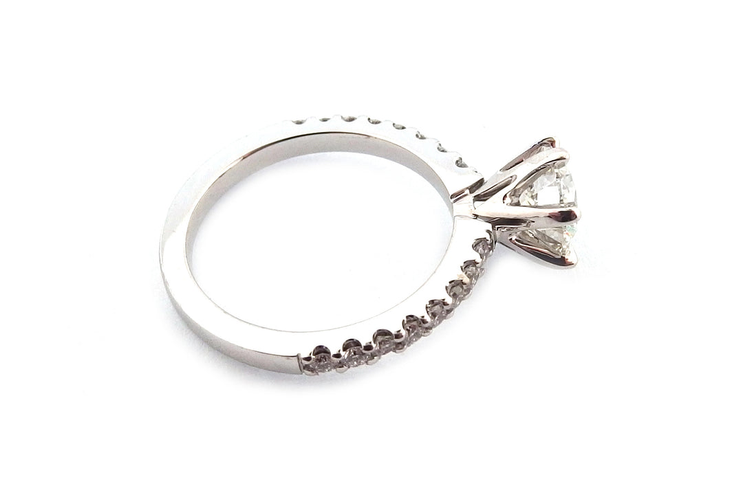 18ct white gold six claw set natural round brilliant cut diamond ring with diamonds on the band