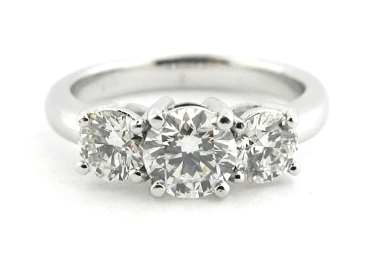 Three stone round brilliant cut diamond ring