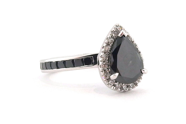 18ct white gold treated black diamond pear shape halo ring with treated back diamonds on the band