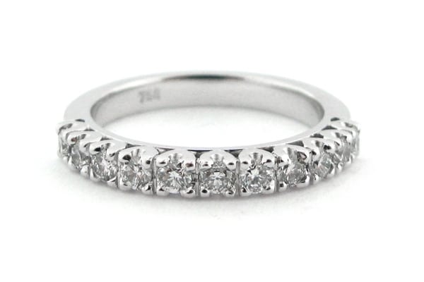 Four claw set round brilliant cut ladies wedding ring