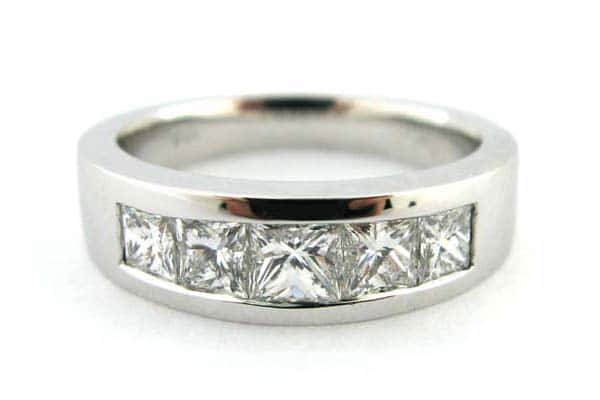 Tapering channel set princess cut diamond ring