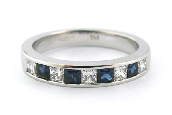Blue sapphire and princess cut diamond channel set ladies wedding ring