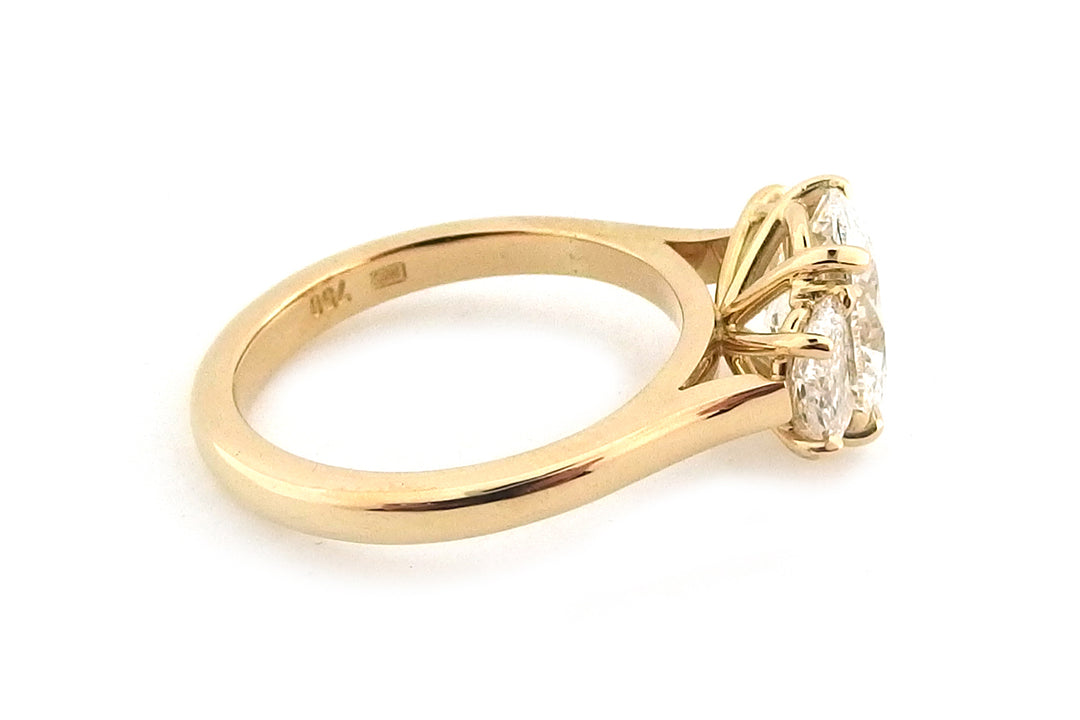18ct yellow gold three stone ring with an oval and two half moon shape diamonds