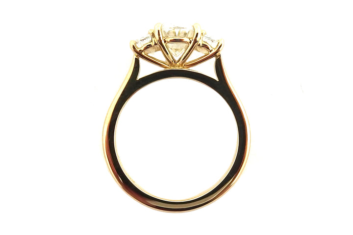 18ct yellow gold three stone ring with an oval and two half moon shape diamonds