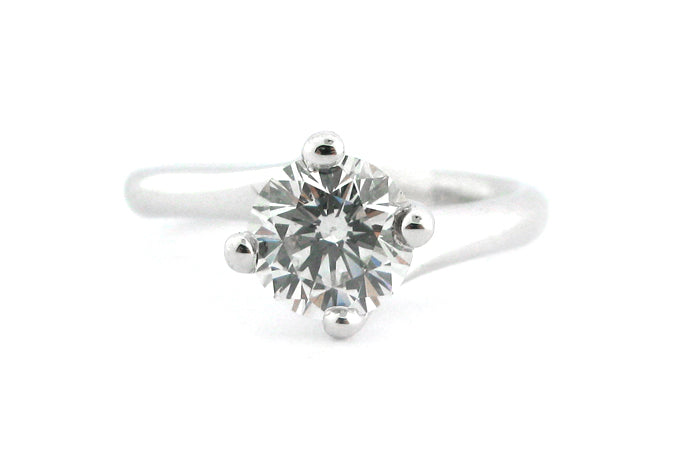 Round brilliant cut diamond four claw set, twisted band
