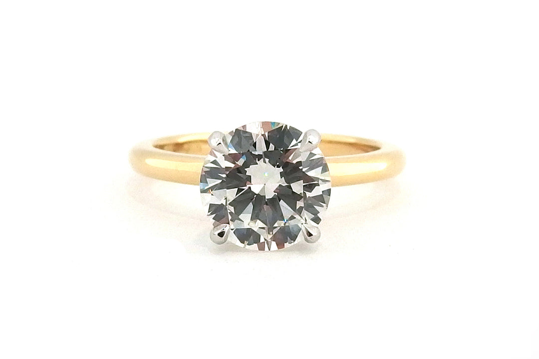 Classic 18ct two tone four claw round brilliant cut diamond ring