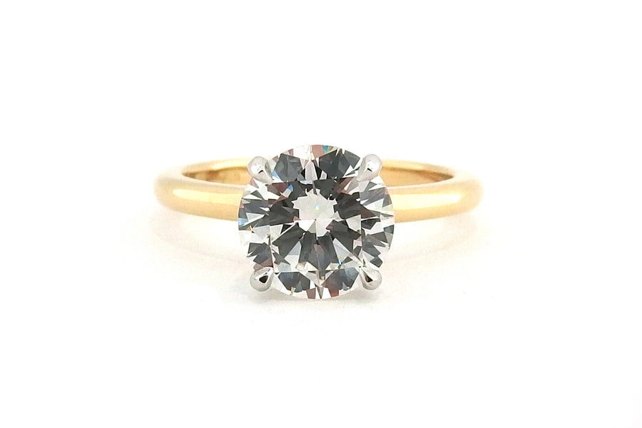 Classic 18ct two tone four claw round brilliant cut diamond ring