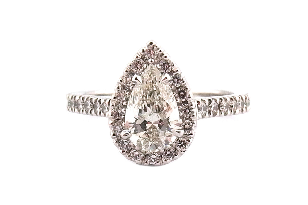 Claw set 18ct white gold pear shape halo ring