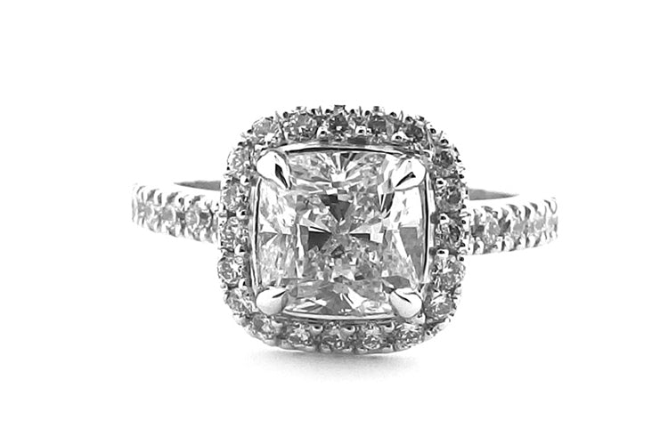 Cushion cut claw set halo ring