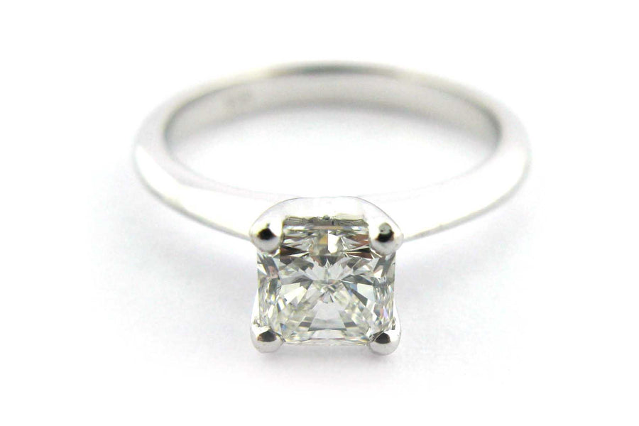 Cushion cut diamond ring with a knife edge band