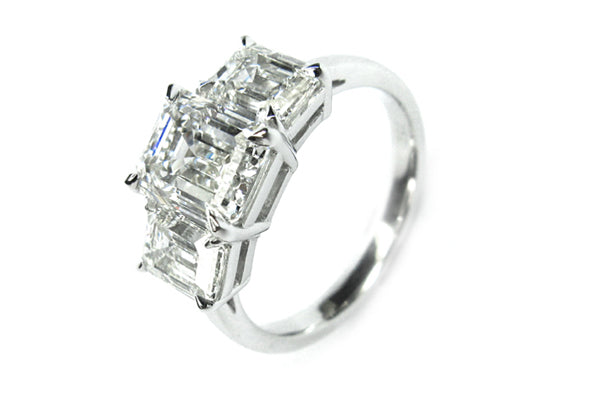Emerald cut diamond three stone ring