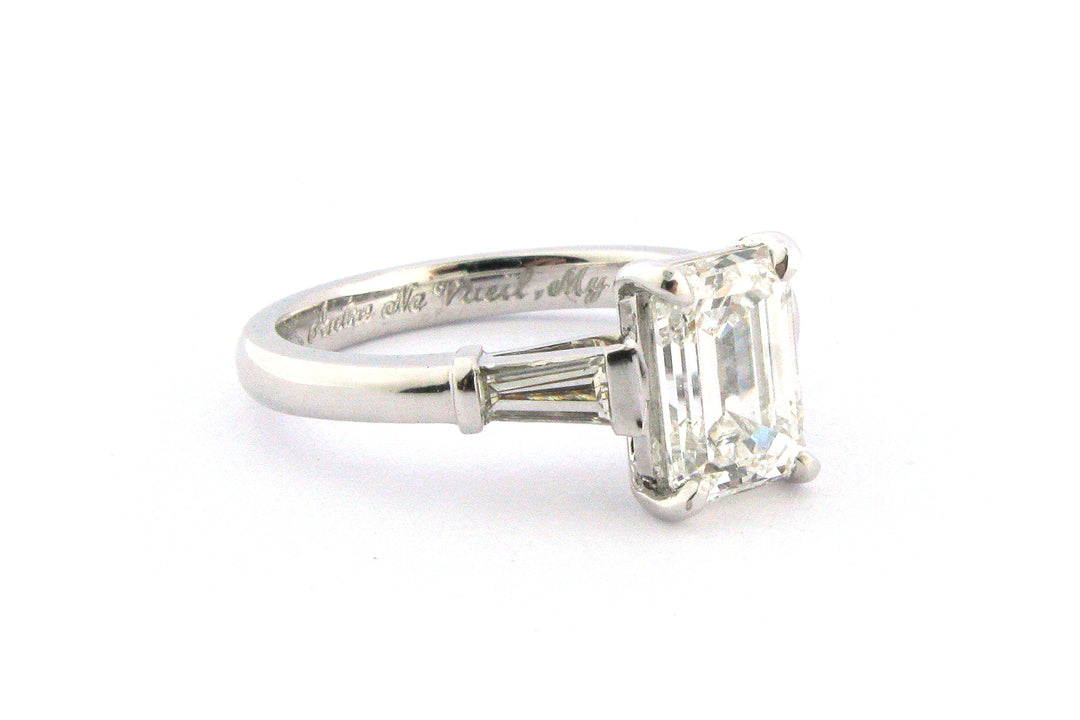 Emerald cut diamond with tapered baguette side stones