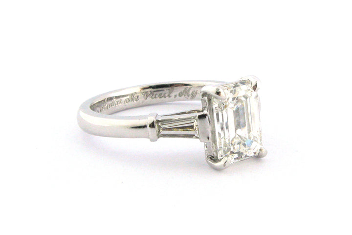 Emerald cut diamond with tapered baguette side stones