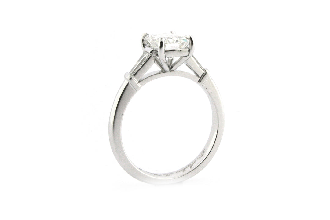 Emerald cut diamond with tapered baguette side stones