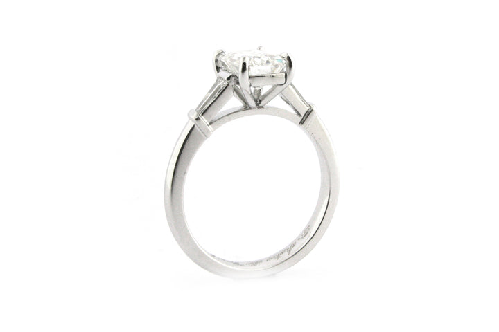 Emerald cut diamond with tapered baguette side stones