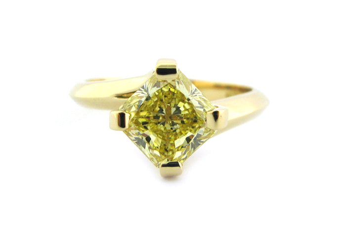 Fancy yellow diamond ring with a twisted band