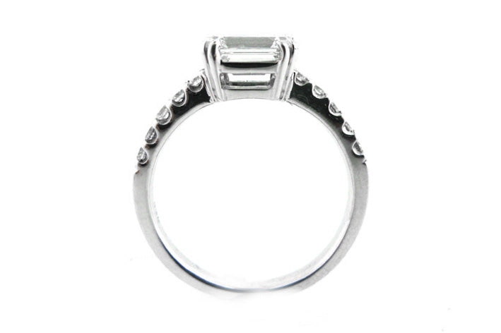 Horizontal emerald cut with claw set diamonds
