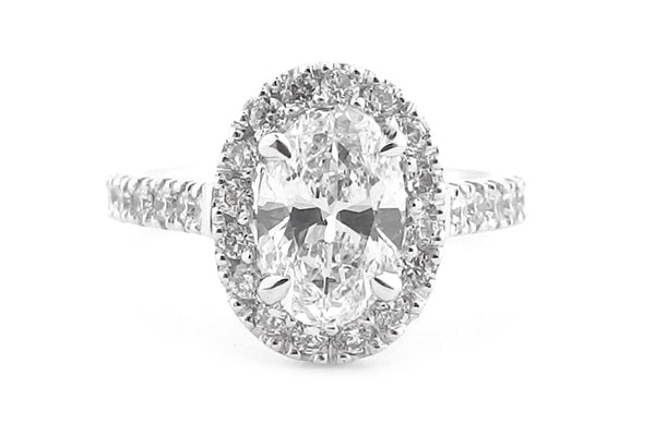 Oval diamond claw set halo ring