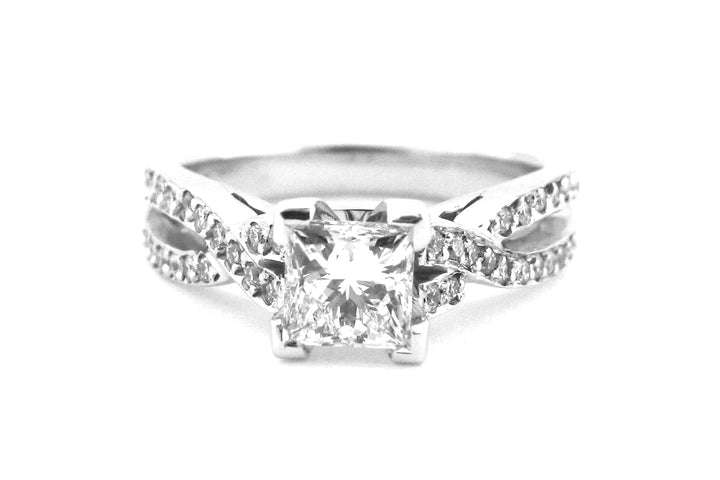 Princess cut diamond ring with a double twisted band