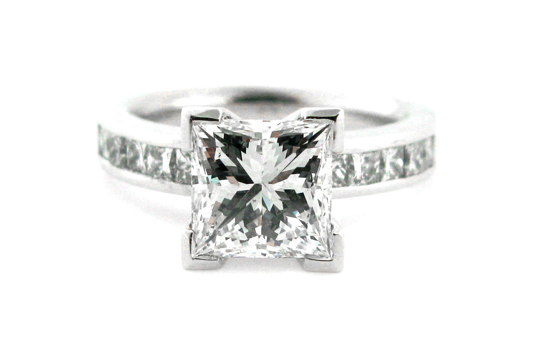 Princess cut diamond ring with channel princess cut diamonds in the band