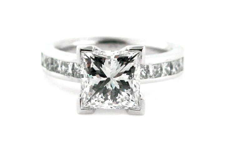 Princess cut diamond ring with channel princess cut diamonds in the band