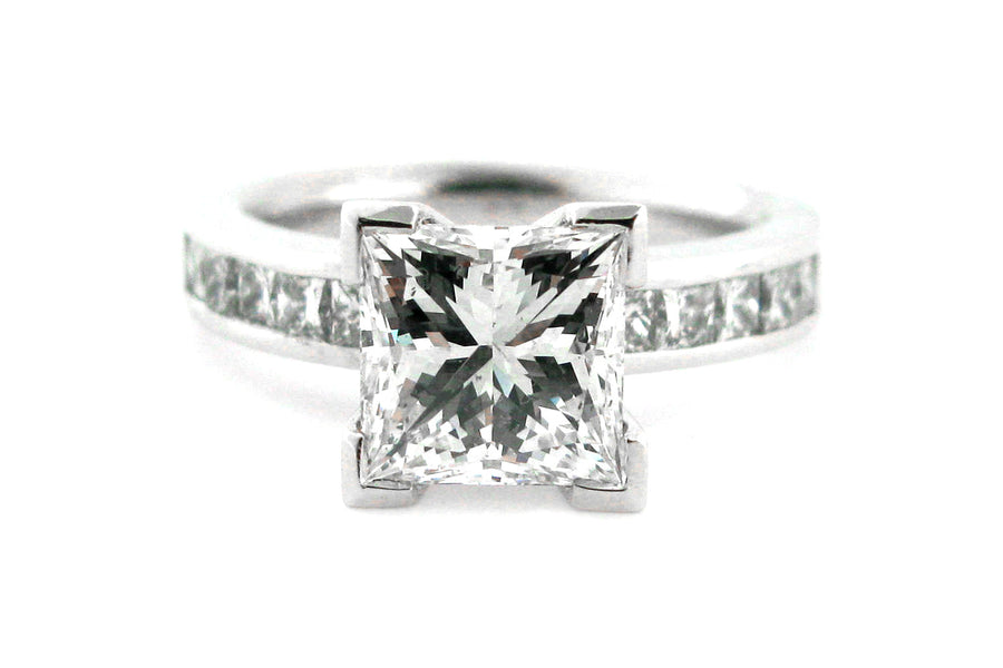 Princess cut diamond ring with channel princess cut diamonds in the band