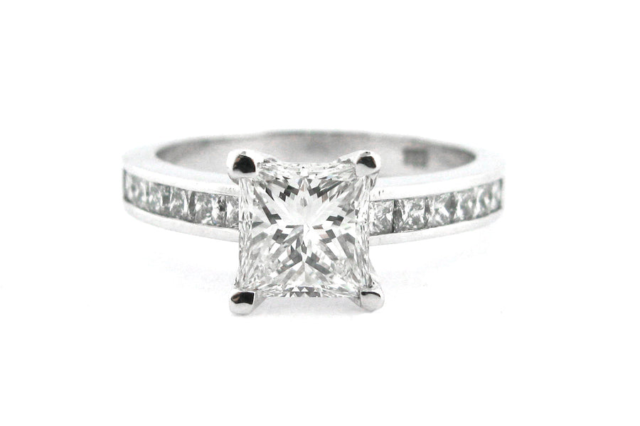 Princess cut diamond ring with channel set diamonds in the band