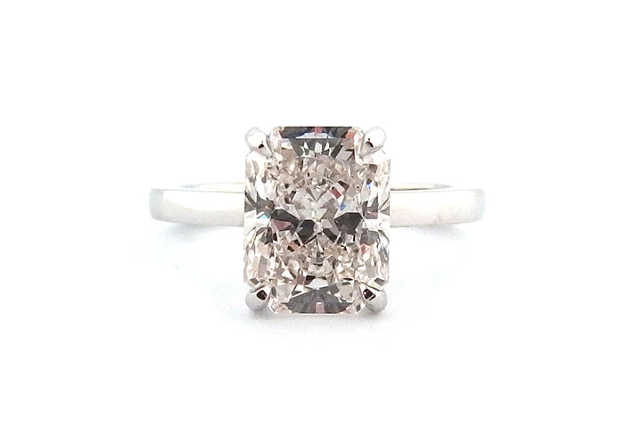 Radiant cut four claw ring