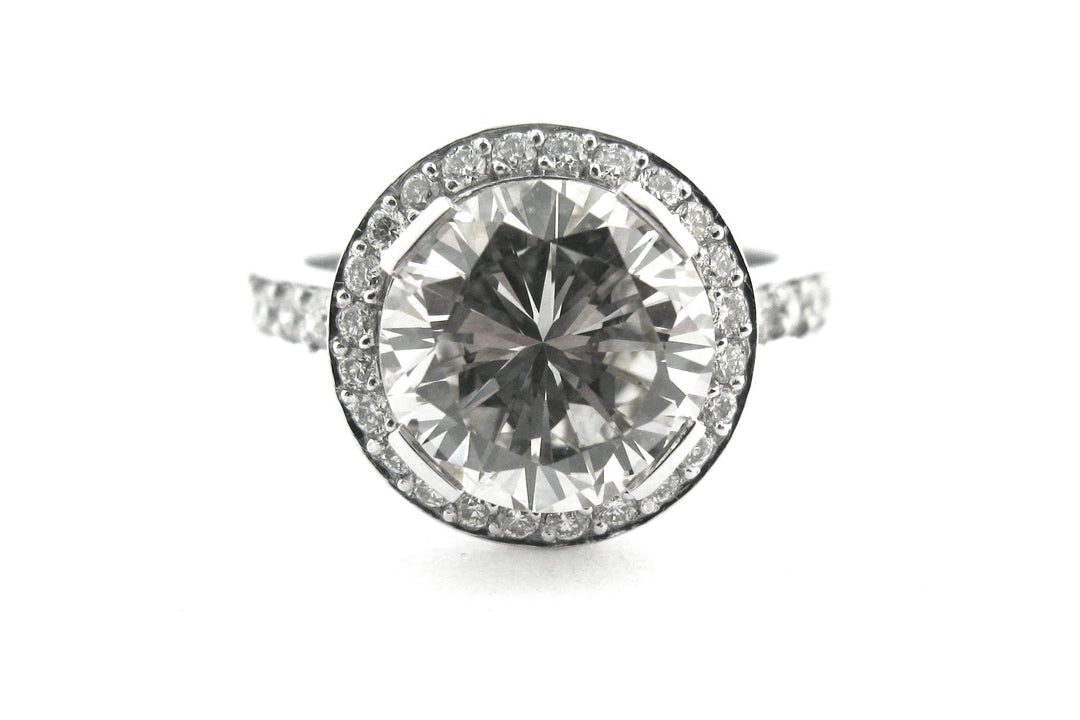 Round brilliant cut diamond ring set with long claws