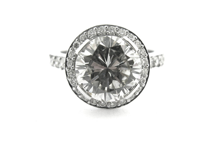 Round brilliant cut diamond ring set with long claws