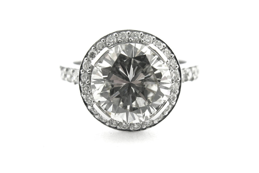 Round brilliant cut diamond ring set with long claws